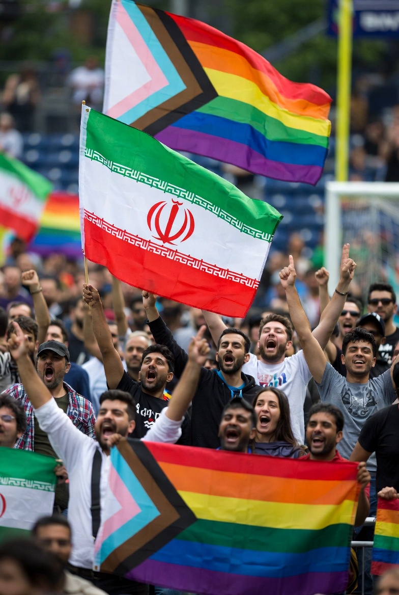 Seattle pride crowd with Iran flags